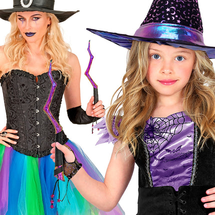 Toverstaf vastgehouden door dame en meisje in heksenkostuum voor Halloween