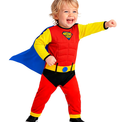 Superheld babyjumpsuit met wapperende blauwe cape en zwart broekdeel, staand gedragen