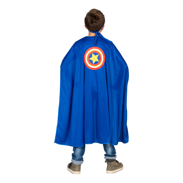 Achterkant van de blauwe cape Jerome met rond schildembleem en gele ster, voor carnaval