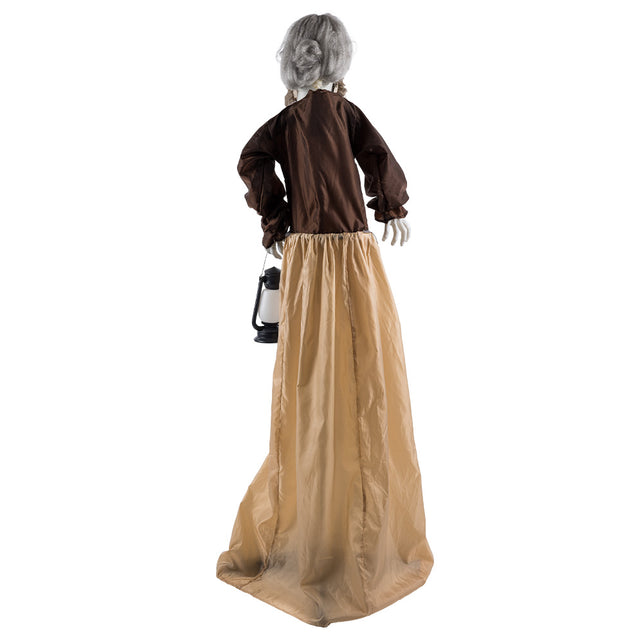 Achterkant van de Lantern witch met grijze knot, bruine pofmouwen en lange beige rok