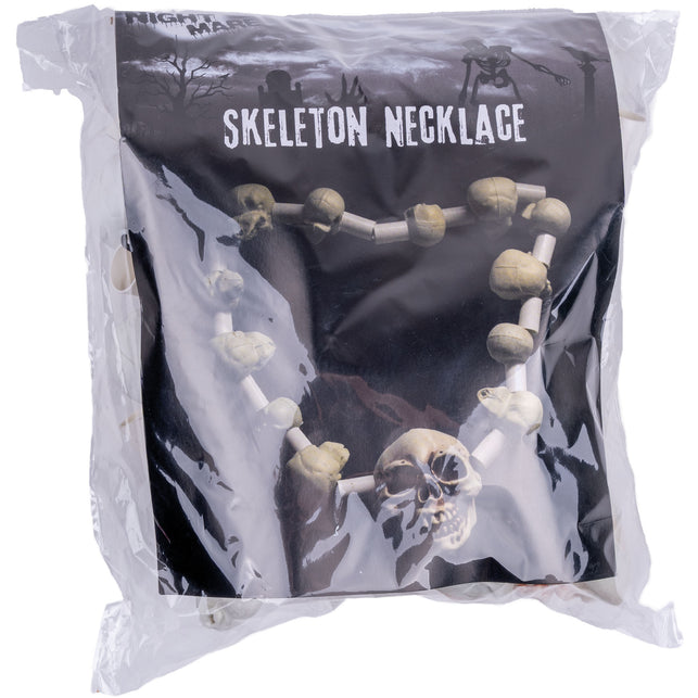 Doodshoofden halsketting in de verpakking, met de botkleurige schedelketting op de voorkant