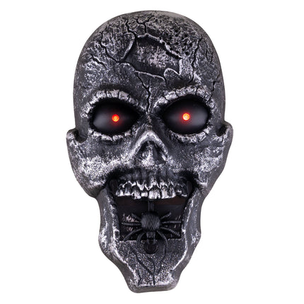 Halloween deurbel schedel met rood oplichtende ogen en zwarte spin in de open mond