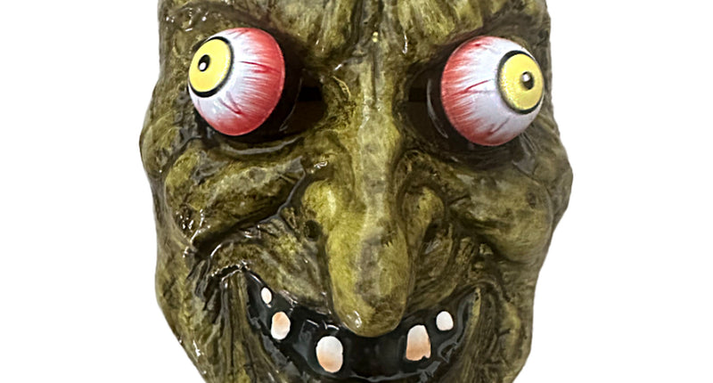 Heksenmasker met bewegende ogen, groen gerimpeld gezicht met gele ogen en grijnzende mond, voor Halloween