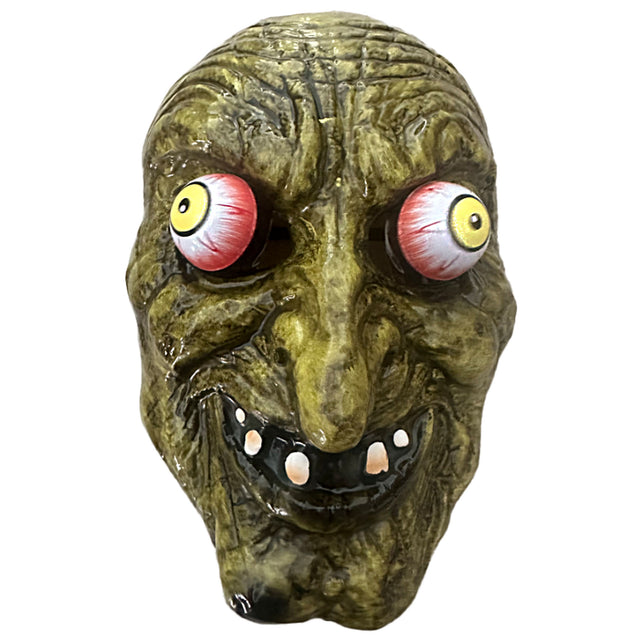 Heksenmasker met bewegende ogen, groen gerimpeld gezicht met gele ogen en grijnzende mond, voor Halloween