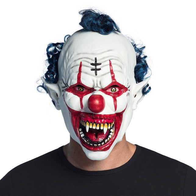 Latex hoofdmasker vampier clown met wit gezicht, rode grijns met hoektanden en blauwe krullen