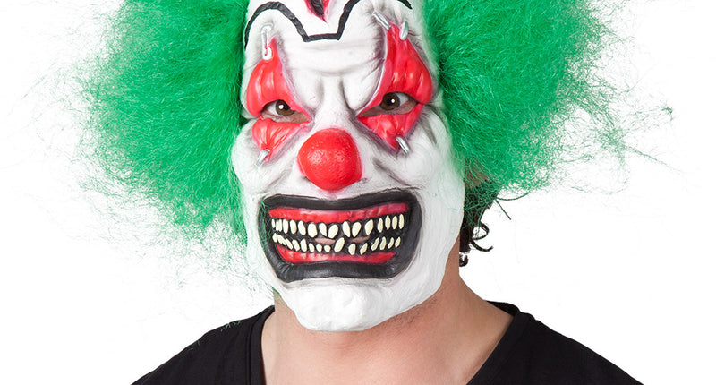 Latex horror clown masker met groen haar, rode neus en grijnzend gebit voor Halloween