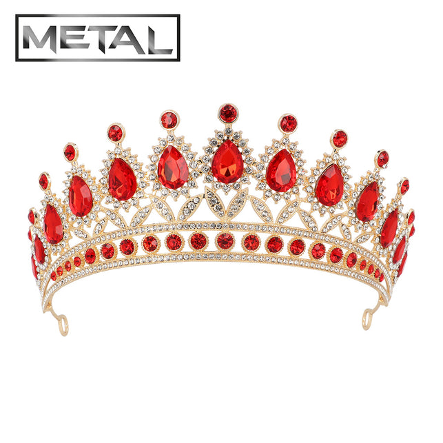 Metalen tiara Royal Christina goud vooraanzicht met rode druppelstenen omringd door kleine heldere steentjes