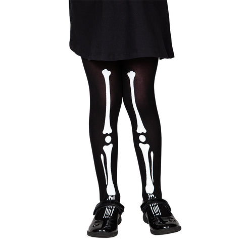 Panty kind Mila skelet in zwart met witte botten, gedragen onder een zwarte rok voor Halloween