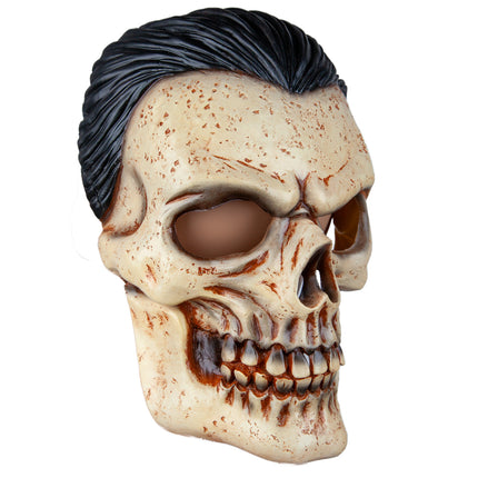 Schedelmasker met zwart haar in driekwart aanzicht, donkerbruine schaduw langs het tandvlees