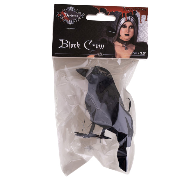 Zwarte kraai in verpakking met clip, gedragen in het haar bij een gothic Halloweenlook