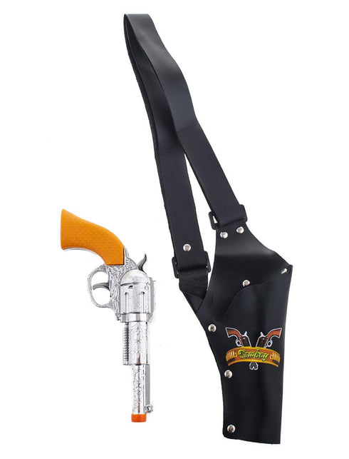 Zwarte schouderholster met klinknagels naast de zilverkleurige speelgoedrevolver met bewerkt patroon